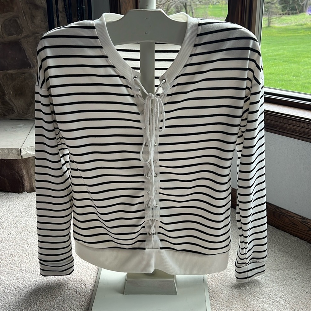 Daytrip - Long sleeve top with lace up front.